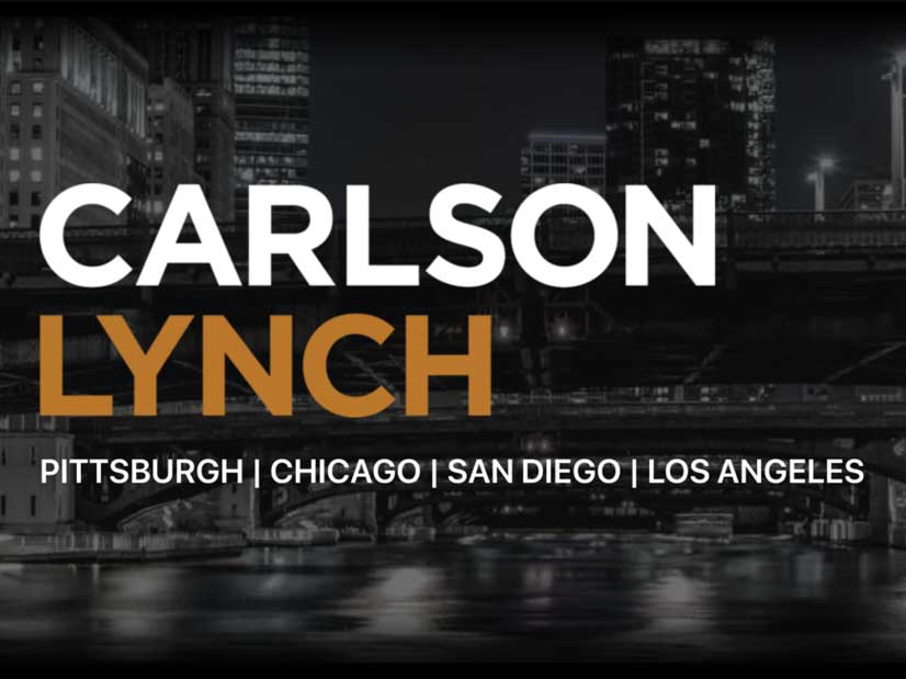 carlson lynch logo on a black and white city backdrop