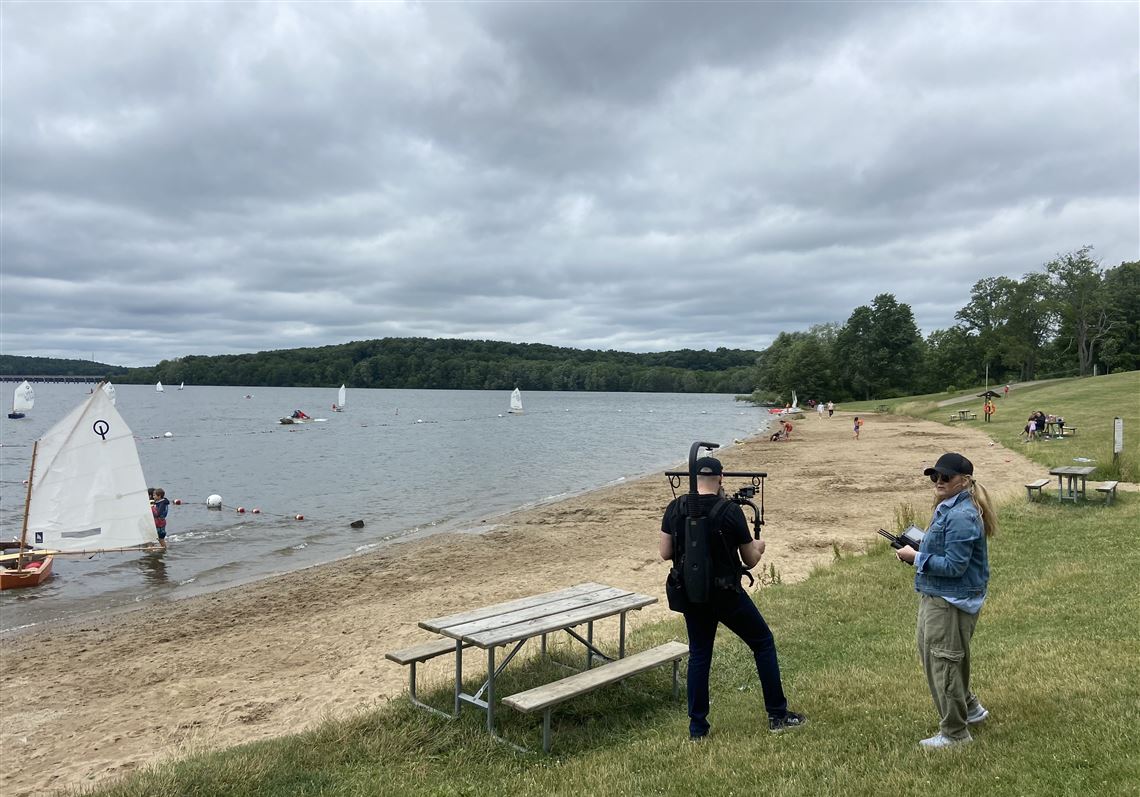 Director of photography Phil Atkins, left, and director Jennifer filming on location for 