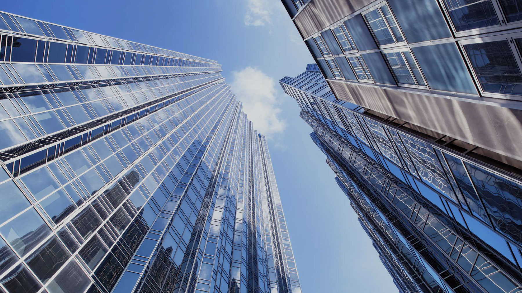looking up at city skyscrapers and the sky